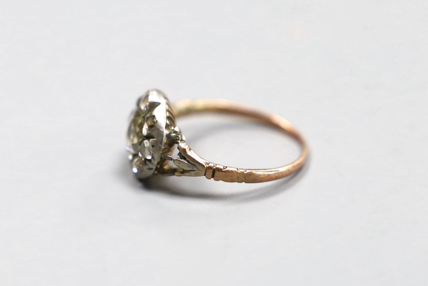 An early 19th century gold and silver mounted rose diamond cluster ring, size E, gross 1.7 grams